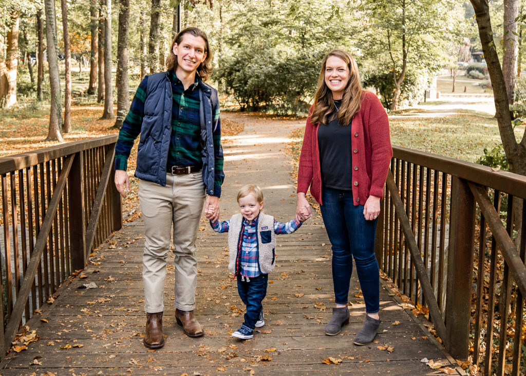 family with a boy at the park having their fall family photo session in Decatur, Georgia.